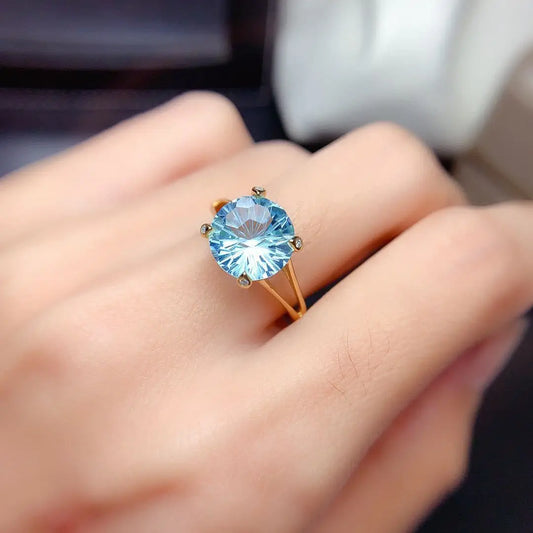 Single 14k gold laboratory aquamarine ring
