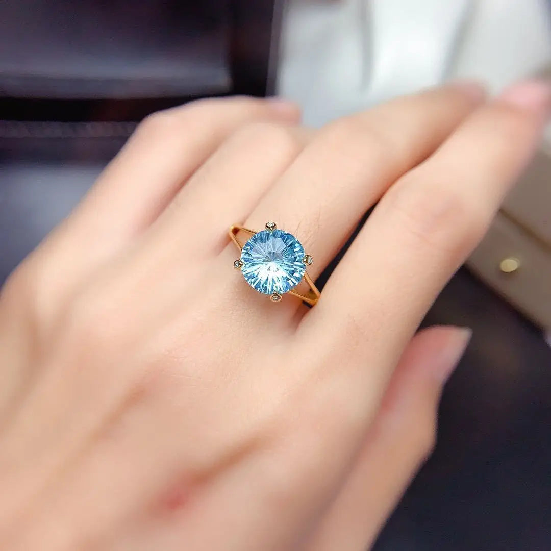 Single 14k gold laboratory aquamarine ring