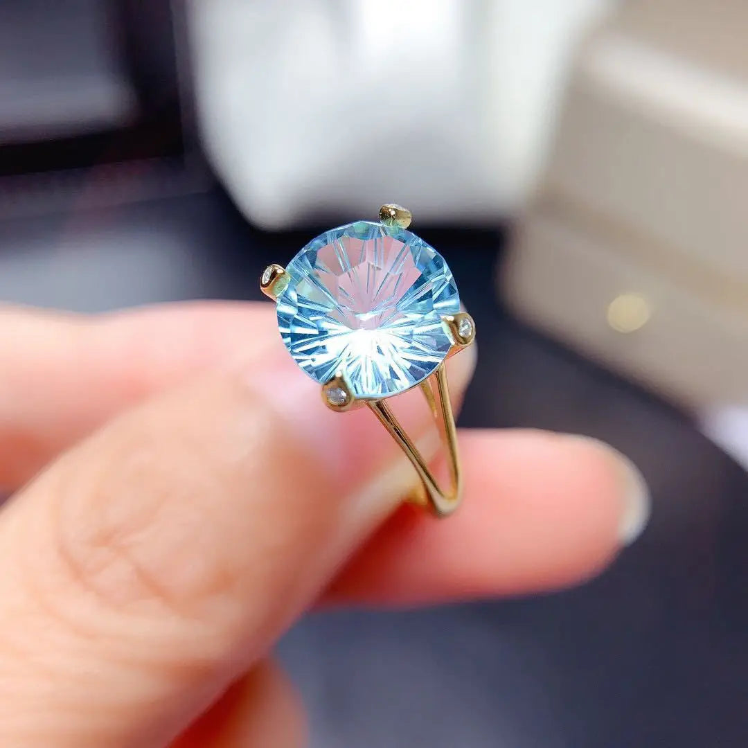 Single 14k gold laboratory aquamarine ring