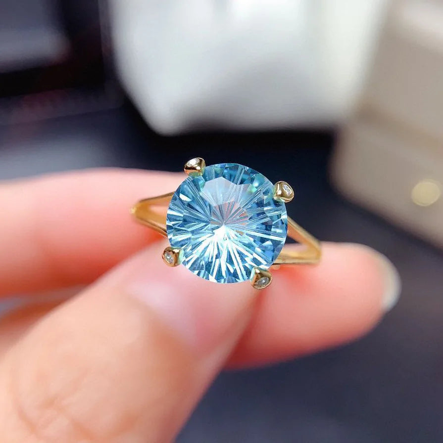 Single 14k gold laboratory aquamarine ring