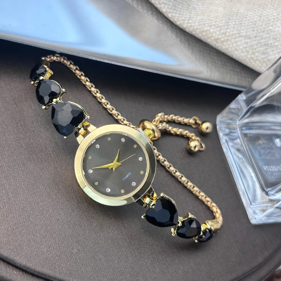 Ladies' quartz watch with three heart-shaped diamond-encrusted bracelet round alloy case and mixed scale simple light luxury